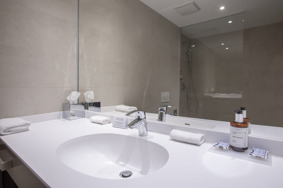 Shower, rainfall showerhead, eco-friendly toiletries, hair dryer