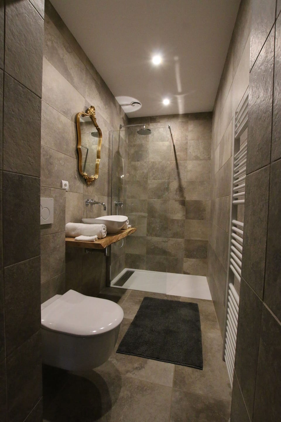 Bathroom | Shower, rainfall showerhead, hair dryer, towels
