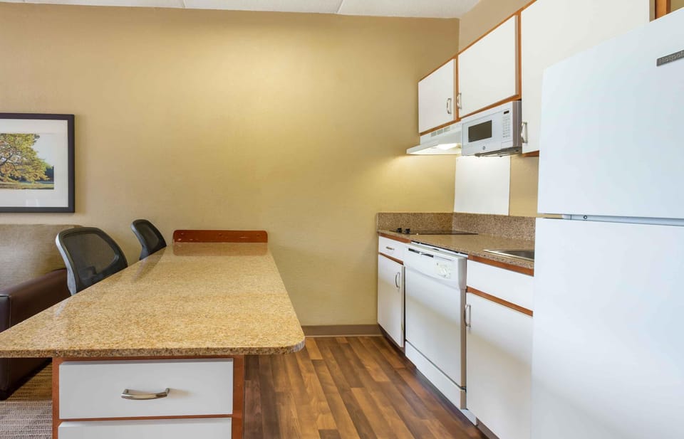 Suite, 1 King Bed with Sofa bed, Non Smoking | Private kitchen | Coffee/tea maker, full-size fridge, microwave, stovetop