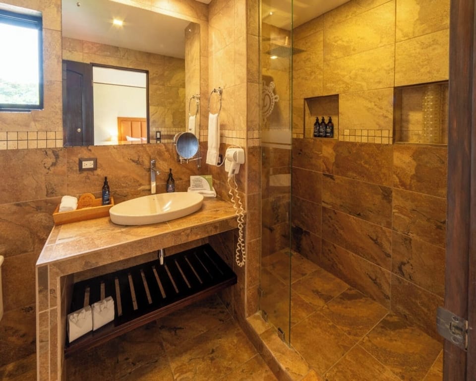 Quetzal 1 Bed | Bathroom | Rainfall showerhead, eco-friendly toiletries, hair dryer, bathrobes