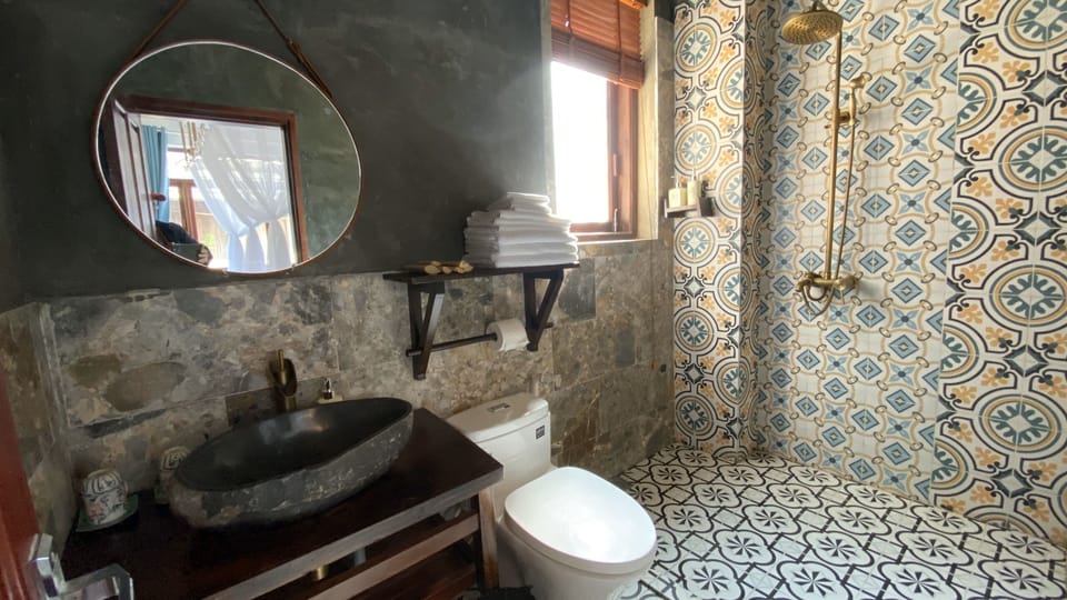 Shower, free toiletries, hair dryer, slippers