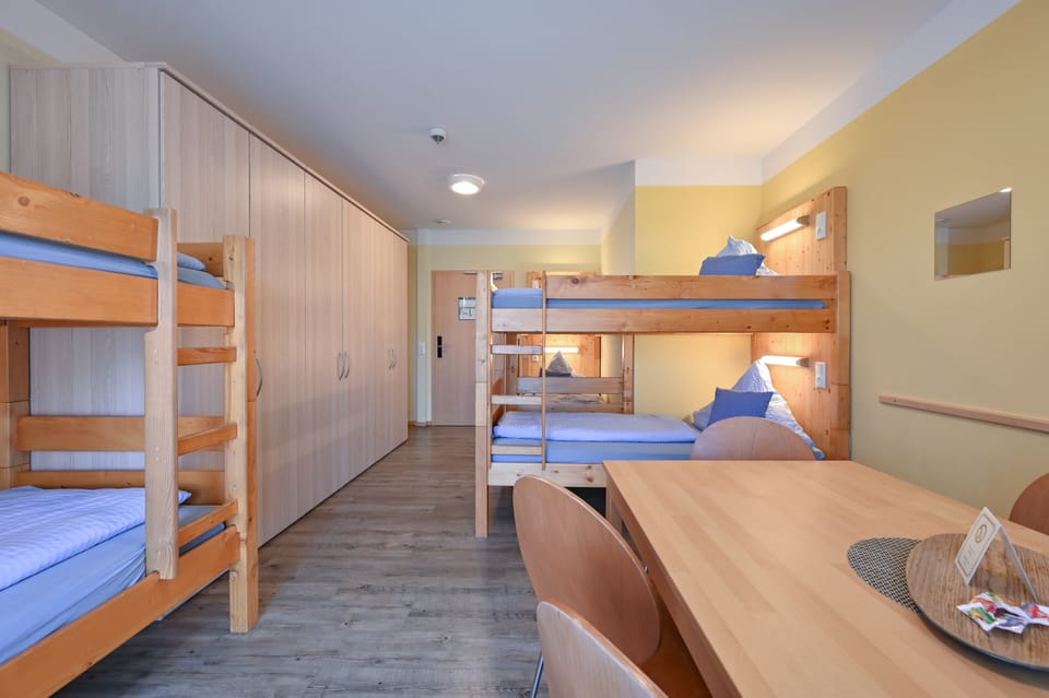 Family Room, Shared Bathroom | Desk, blackout drapes, soundproofing, cribs/infant beds