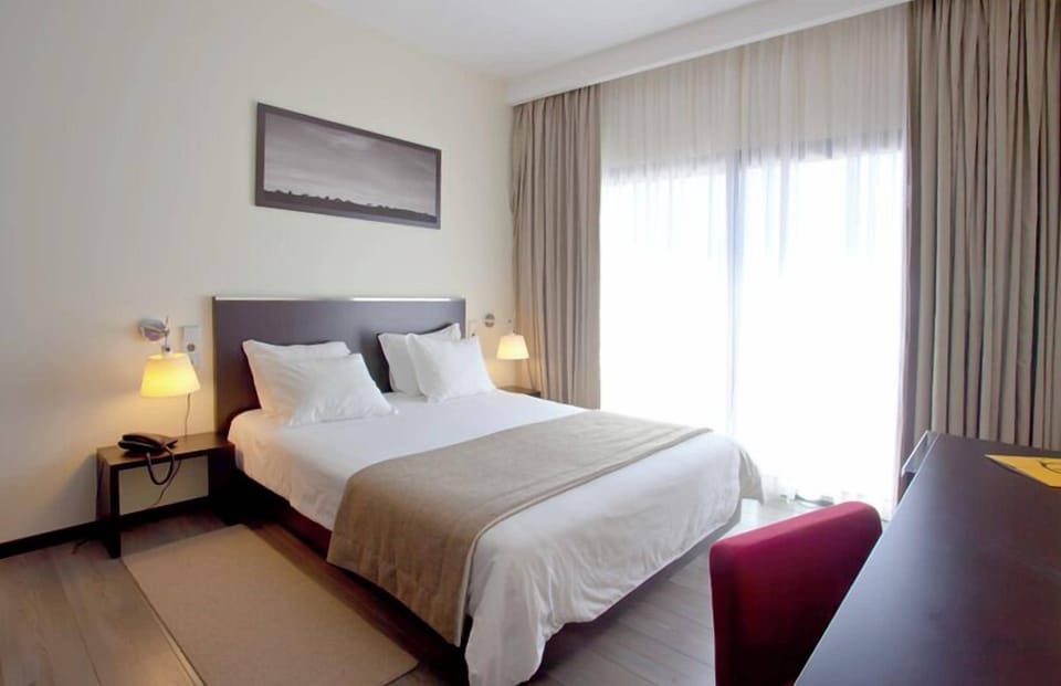 Double or Twin Room | Minibar, in-room safe, iron/ironing board, free WiFi