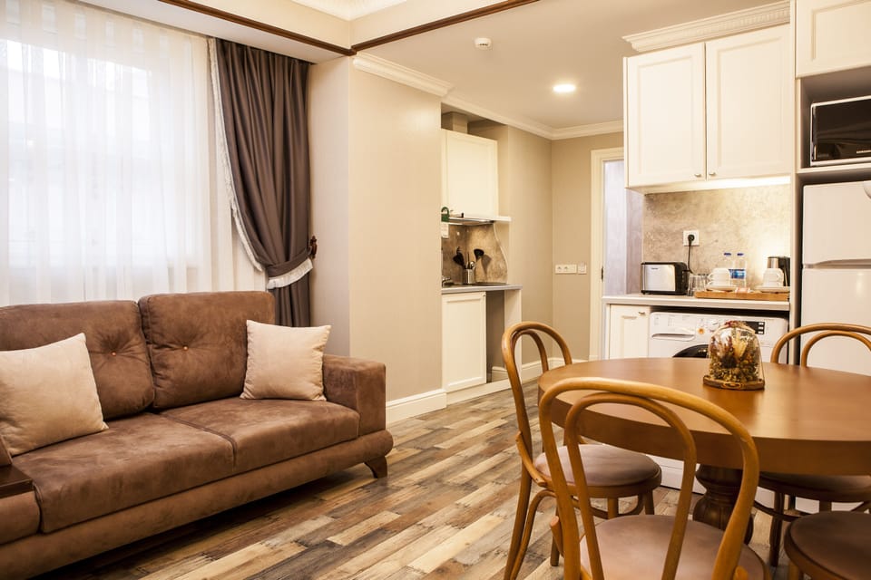 Deluxe Apartment, 2 Bedrooms | Living area | 56-inch LED TV with satellite channels, TV