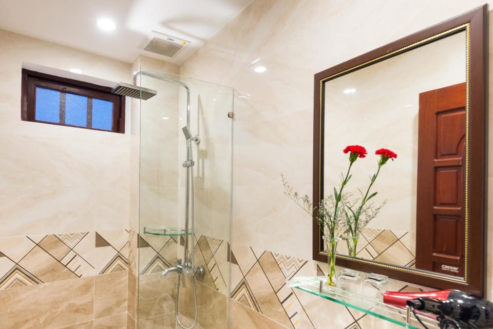 Shower, free toiletries, hair dryer, slippers