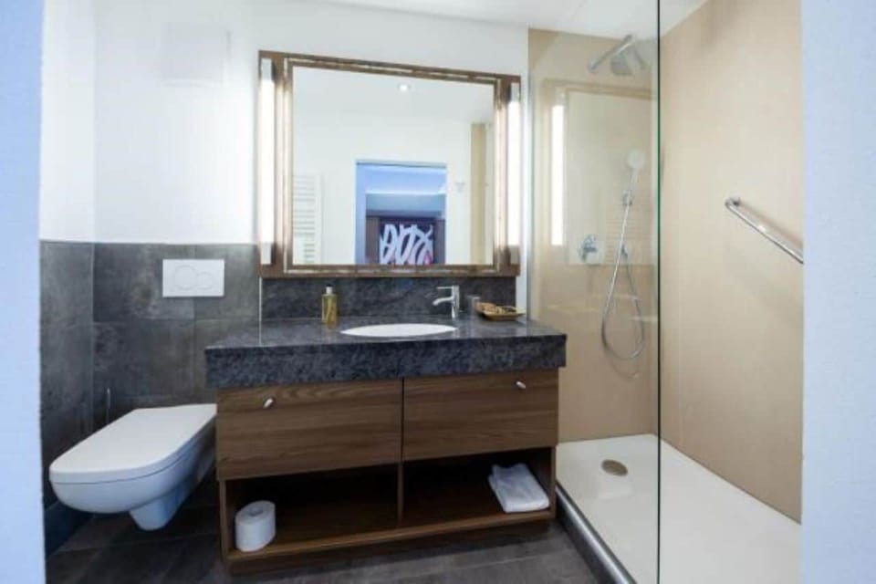 Shower, free toiletries, hair dryer, slippers