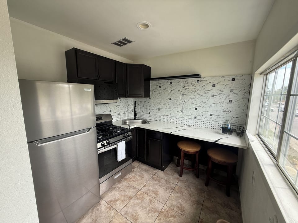 Deluxe Room, 1 King Bed, Kitchenette | Private kitchen | Fridge, microwave