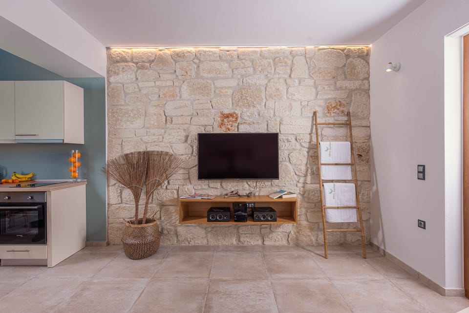 Junior Suite, Sea View | Living area | 50-inch flat-screen TV with cable channels, TV
