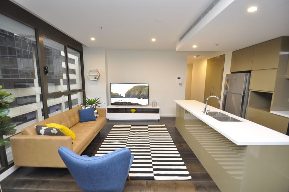 City Apartment | Living area | 55-inch flat-screen TV with digital channels, LCD TV