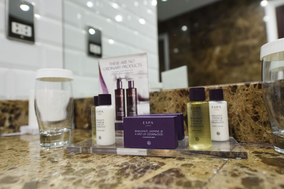 Combined shower/tub, free toiletries, hair dryer, slippers