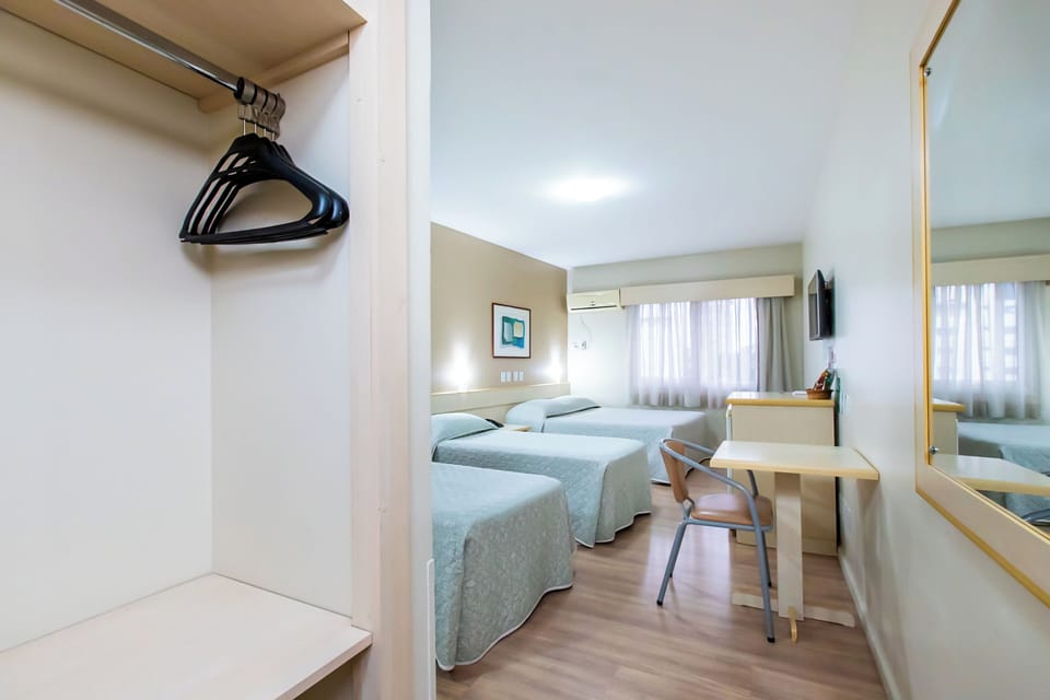 Standard Quadruple Room | Minibar, in-room safe, desk, blackout drapes