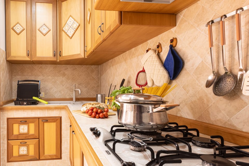 Apartment, 3 Bedrooms | Private kitchen | Full-size fridge, microwave, oven, stovetop