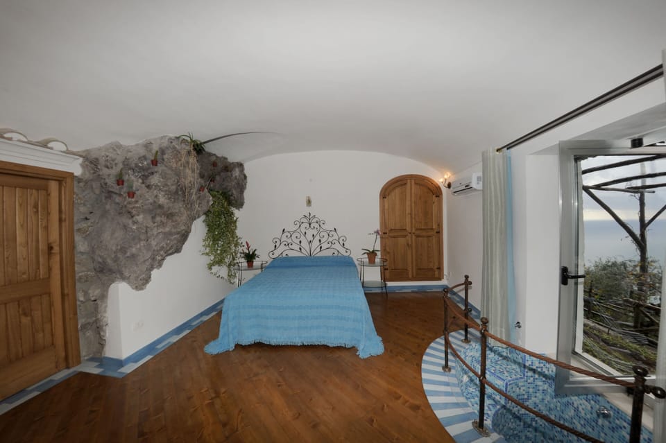 Deluxe Double Room, Terrace, Sea View | Minibar, individually decorated, bed sheets