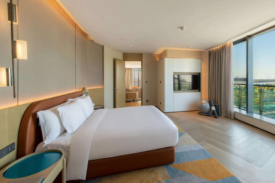 Premium bedding, down comforters, free minibar items, in-room safe