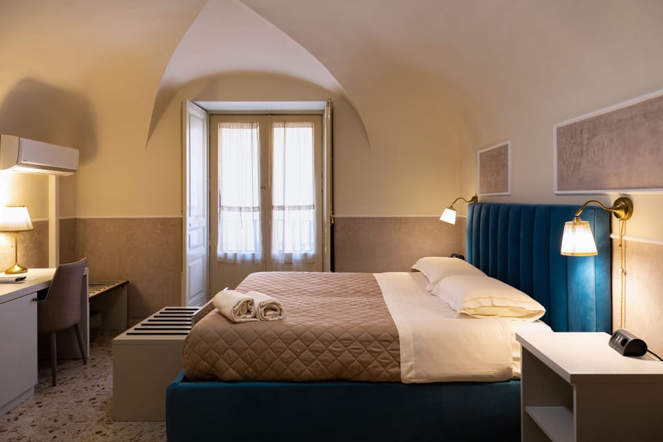 Standard Triple Room, City View | Minibar, in-room safe, individually furnished, desk