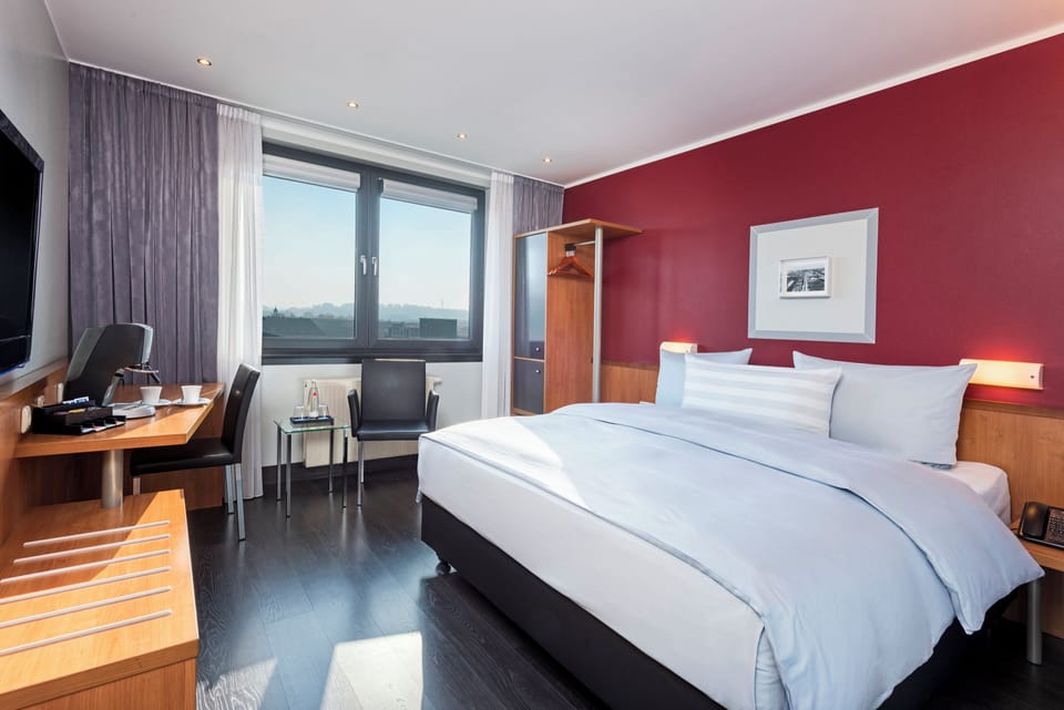 Premium bedding, pillowtop beds, desk, blackout drapes