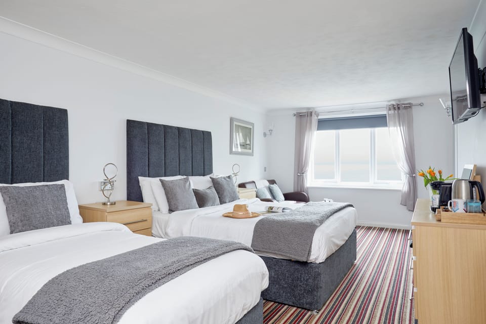 Family Room, Sea View | In-room safe, desk, iron/ironing board, cribs/infant beds