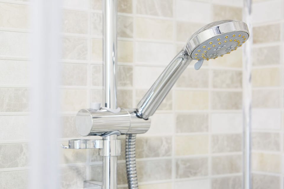 Designer toiletries, hair dryer, towels