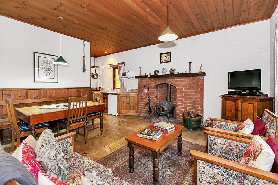 Cottage, 2 Bedrooms (Hobbit) | Living area | 50-inch flat-screen TV with digital channels, LCD TV, fireplace