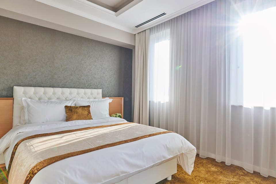 Deluxe Suite, Terrace | Premium bedding, memory foam beds, minibar, desk