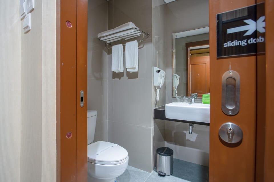 Shower, free toiletries, slippers, towels