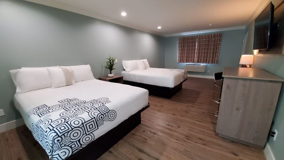 Basic Room, 2 Queen Beds, Non Smoking | WiFi (free), bed sheets