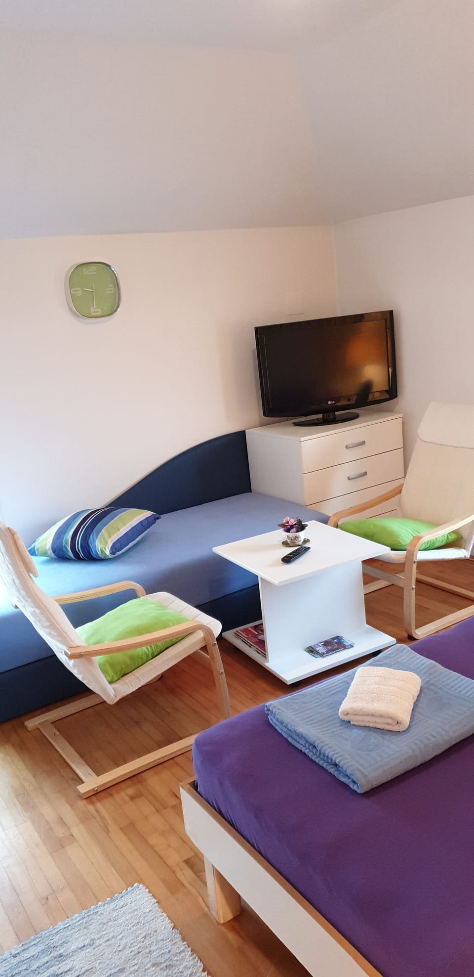 Triple Room | Living area | Flat-screen TV