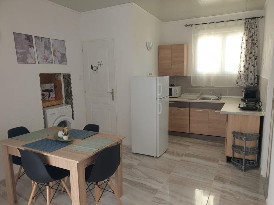 Family Apartment, 2 Bedrooms, Sea View | Private kitchen | Fridge, stovetop, coffee/tea maker, electric kettle