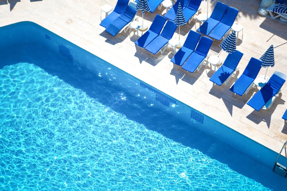 Outdoor pool, open 10:00 AM to 6:00 PM, pool umbrellas, sun loungers