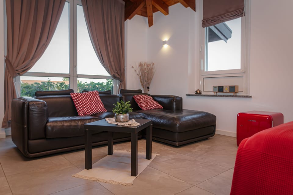 Luxury Quadruple Room | Living area | Flat-screen TV, heated floors