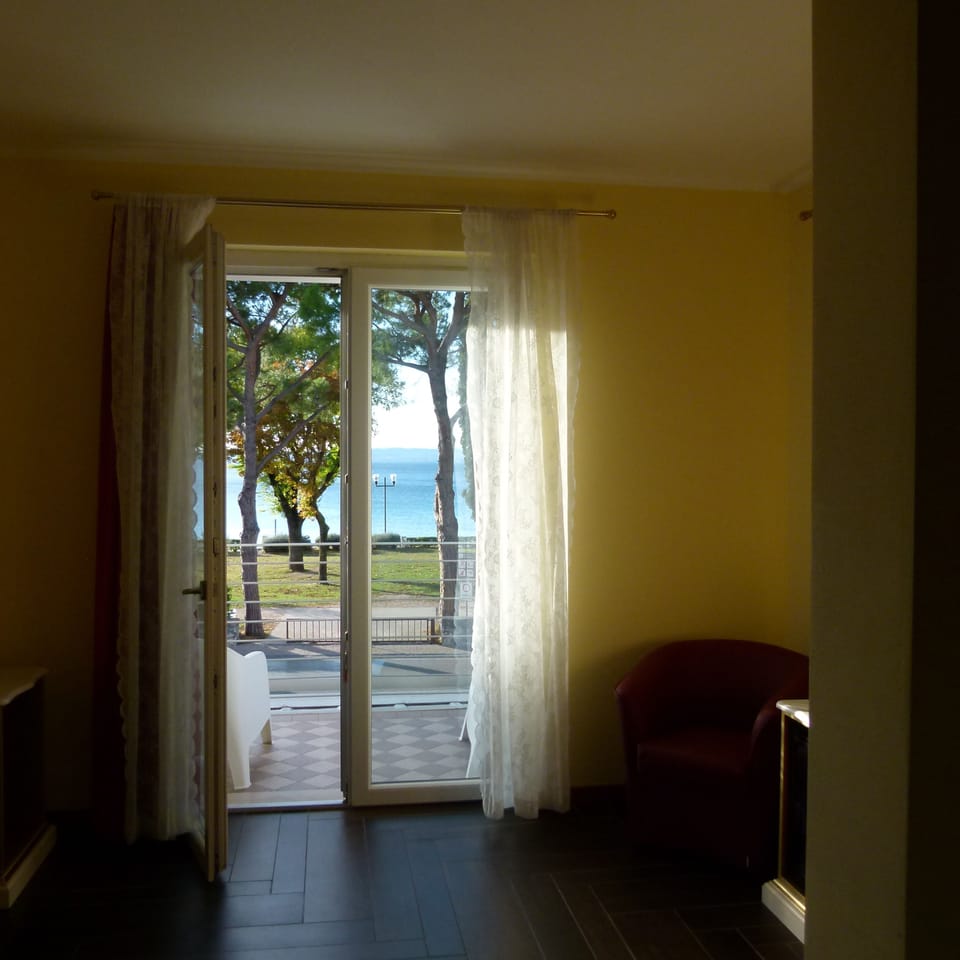 Superior Double Room, Balcony, Lake View | Down comforters, minibar, in-room safe, desk