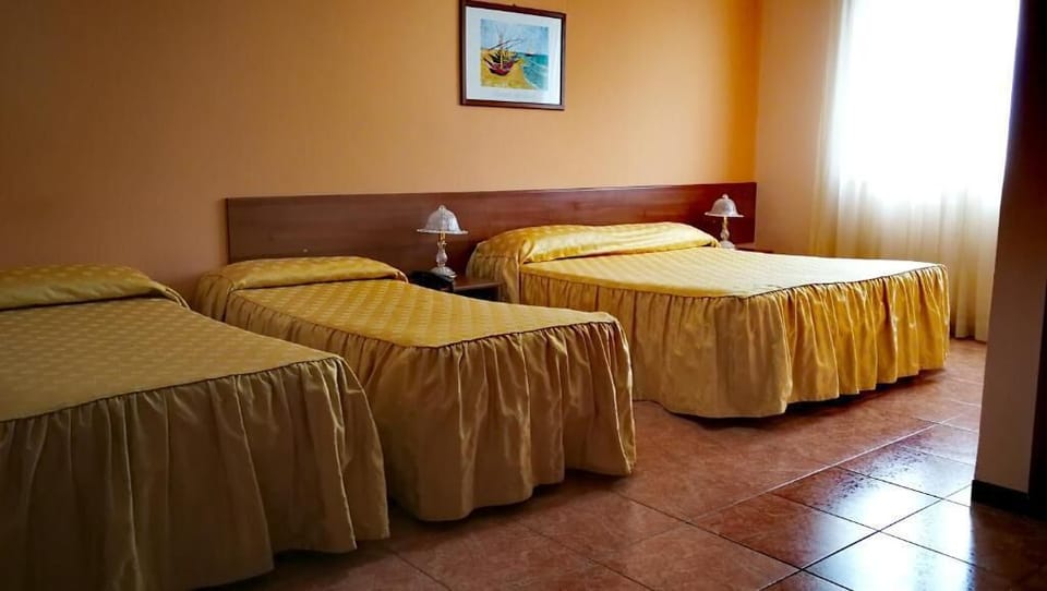 Comfort Quadruple Room | In-room safe, desk, soundproofing, free WiFi