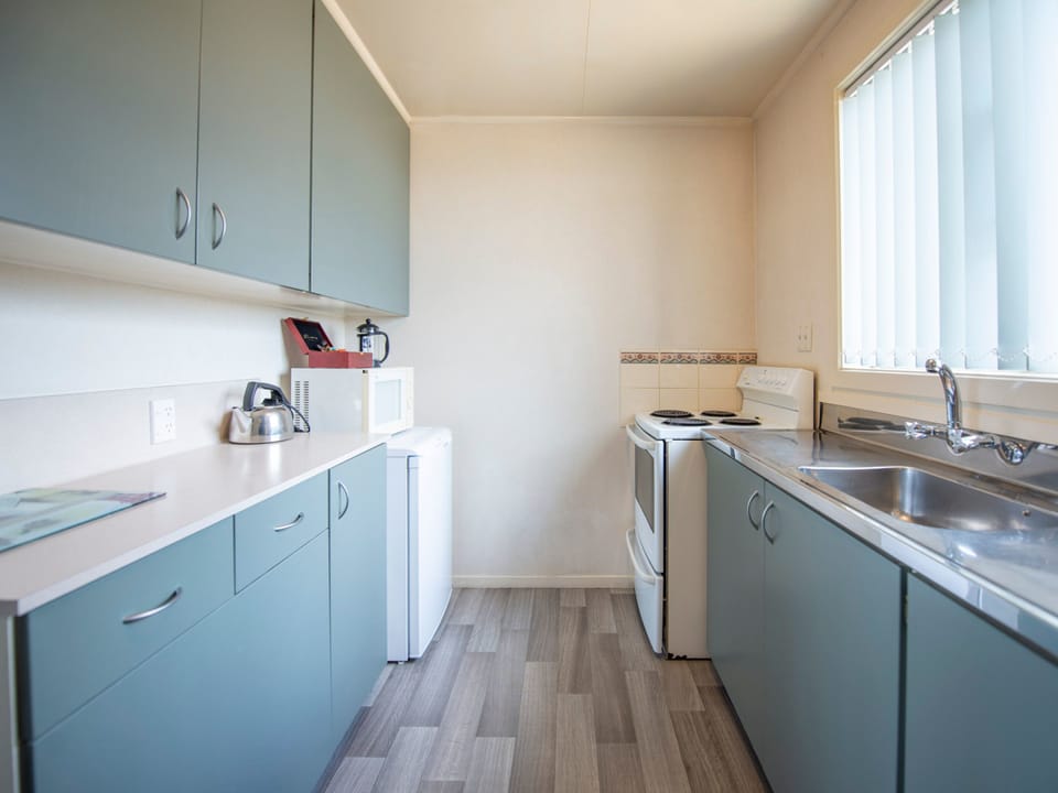 Family Suite, 2 Bedrooms | Private kitchen | Coffee/tea maker, fridge, microwave, electric kettle