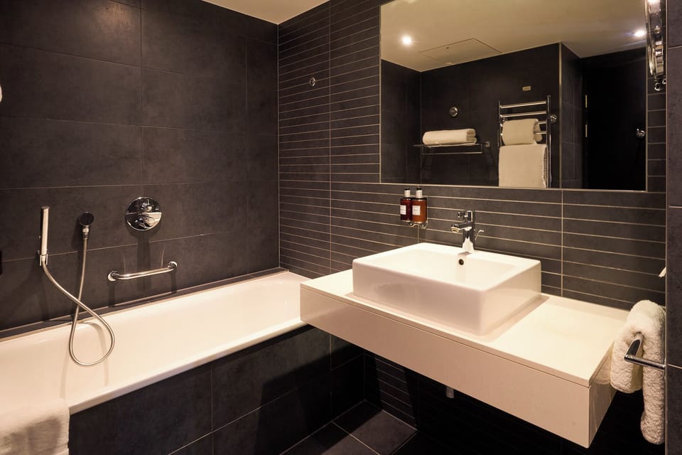 Suite | Bathroom | Shower, designer toiletries, hair dryer, towels
