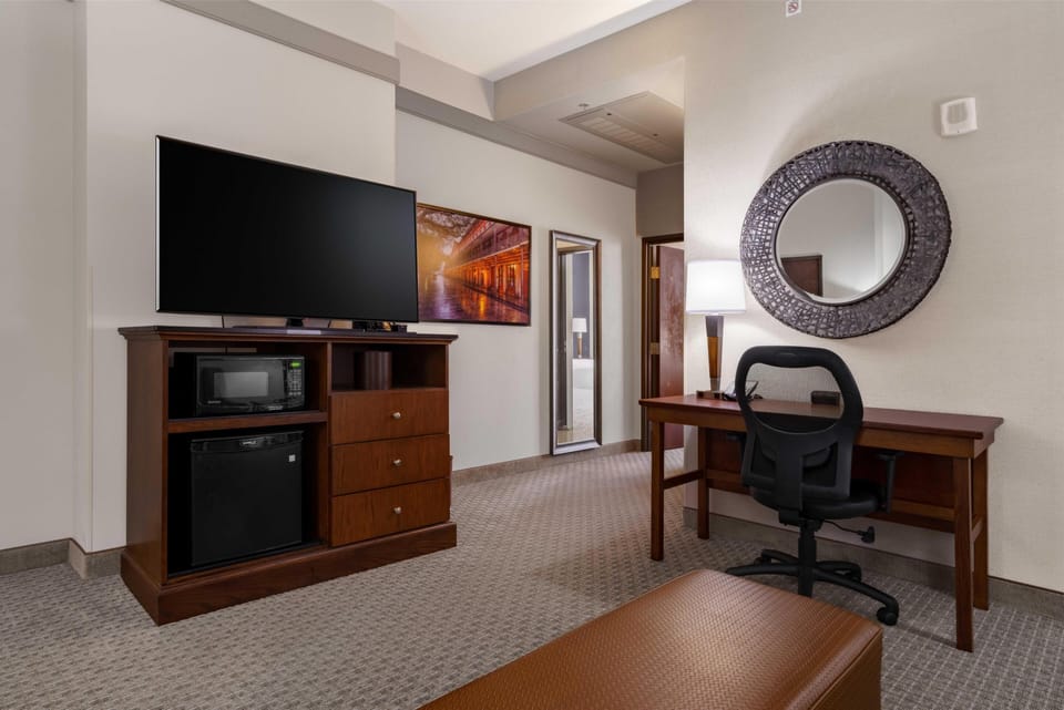 Desk, laptop workspace, blackout drapes, iron/ironing board