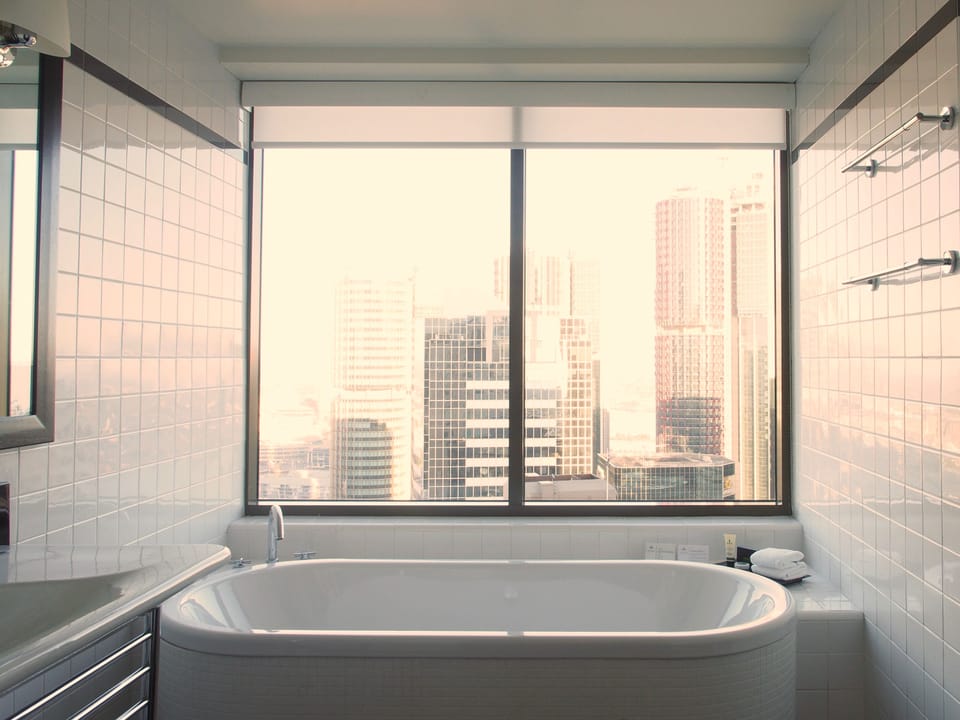 Deluxe Corner King	 | Bathroom | Separate tub and shower, free toiletries, hair dryer, bathrobes