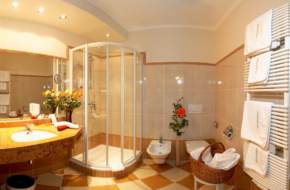 Designer toiletries, hair dryer, bathrobes, towels