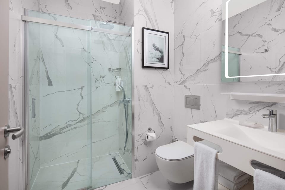 Shower, free toiletries, hair dryer, bathrobes
