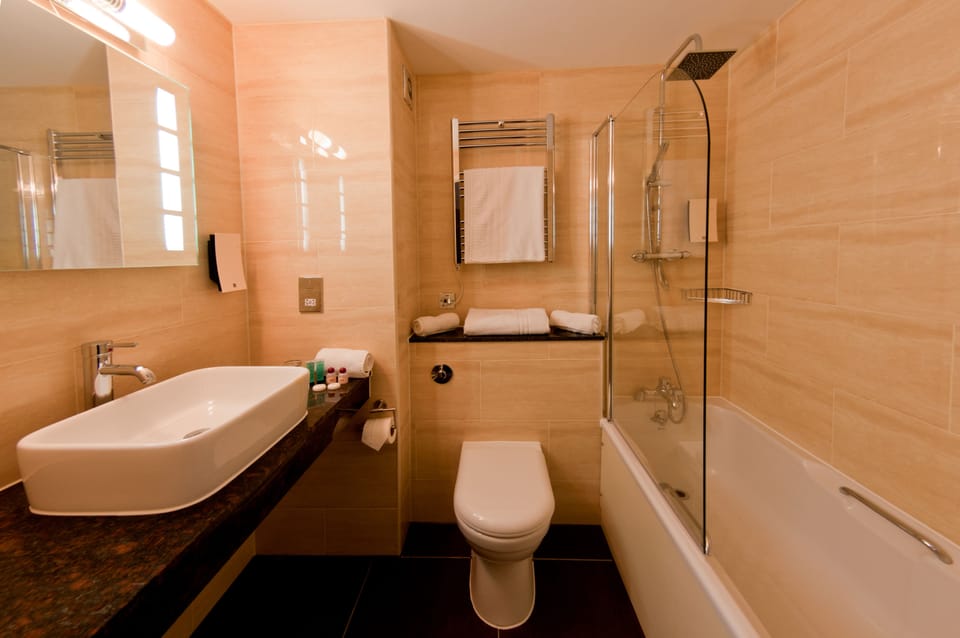 Combined shower/tub, hair dryer, towels, soap