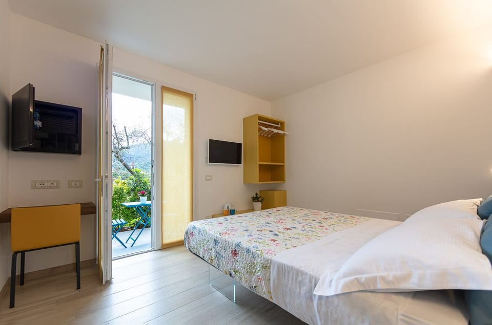 Superior Room, Ground Floor | Minibar, in-room safe, desk, laptop workspace