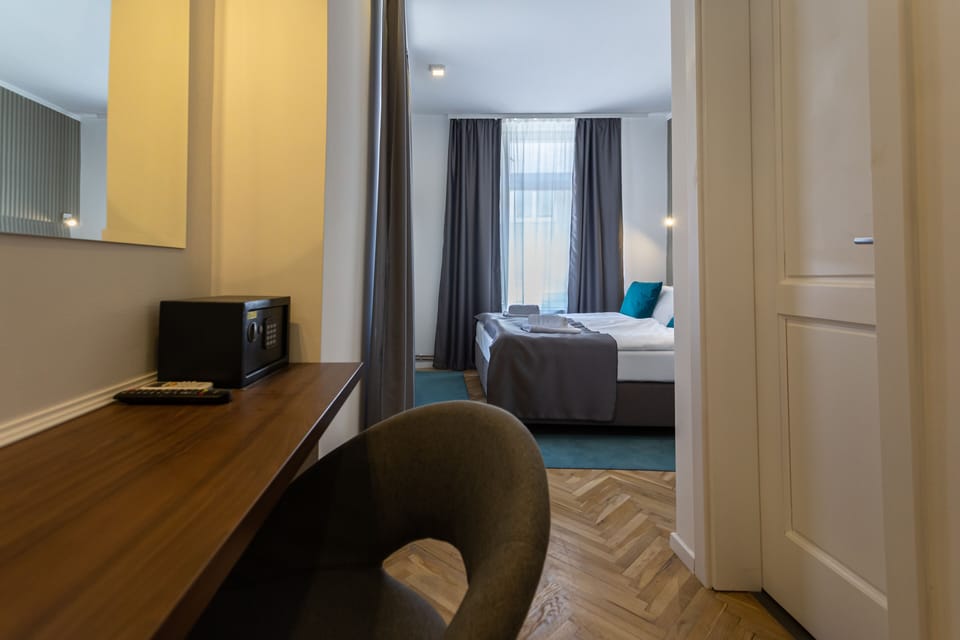 Deluxe Double or Twin Room | Desk, blackout drapes, iron/ironing board, free cribs/infant beds