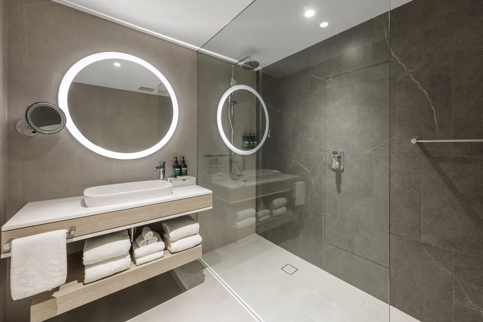 Premium Room, 2 Queen Beds | Bathroom | Free toiletries, hair dryer, bathrobes, slippers