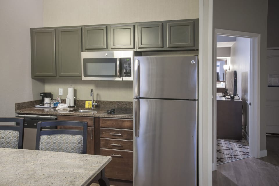 Suite, 1 King Bed with Sofa bed, Kitchen | Private kitchen | Coffee/tea maker, fridge, microwave, cookware/dishes/utensils