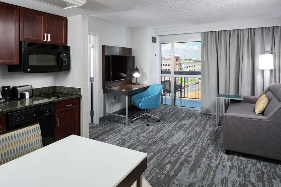 Suite, 1 King Bed with Sofa bed, Kitchen, Park View (Balcony) | In-room safe, desk, laptop workspace, iron/ironing board