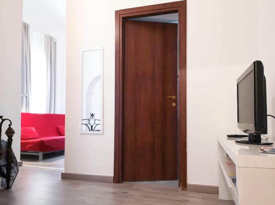 Deluxe Room (3rd floor, stair access only) | Living area | Flat-screen TV