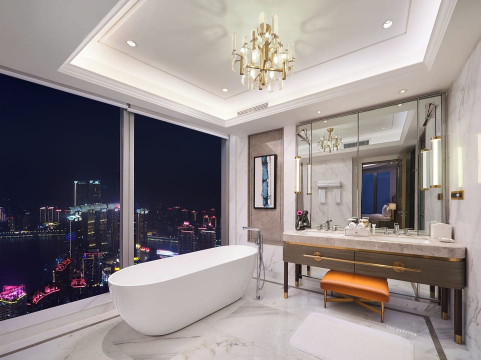Executive Suite, 1 King Bed, River View | Bathroom | Separate tub and shower, rainfall showerhead, designer toiletries