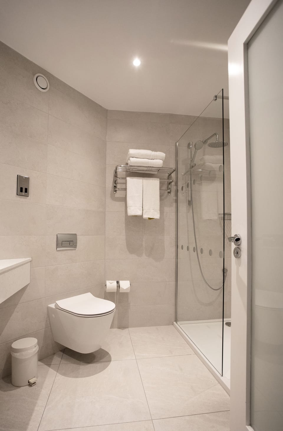 Shower, rainfall showerhead, designer toiletries, hair dryer