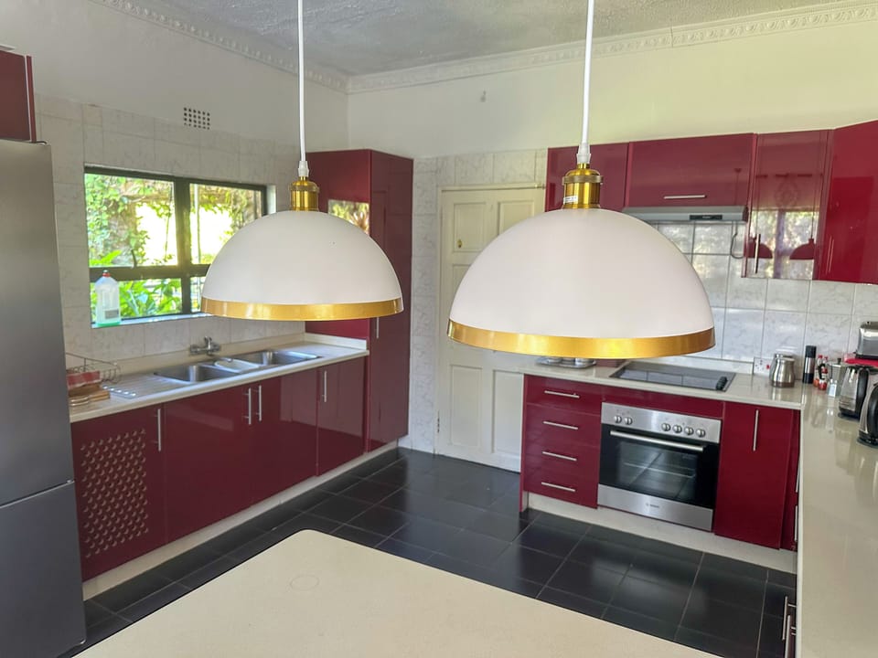 Sunbirds Chobe Villa | Private kitchen | Electric kettle, dining table