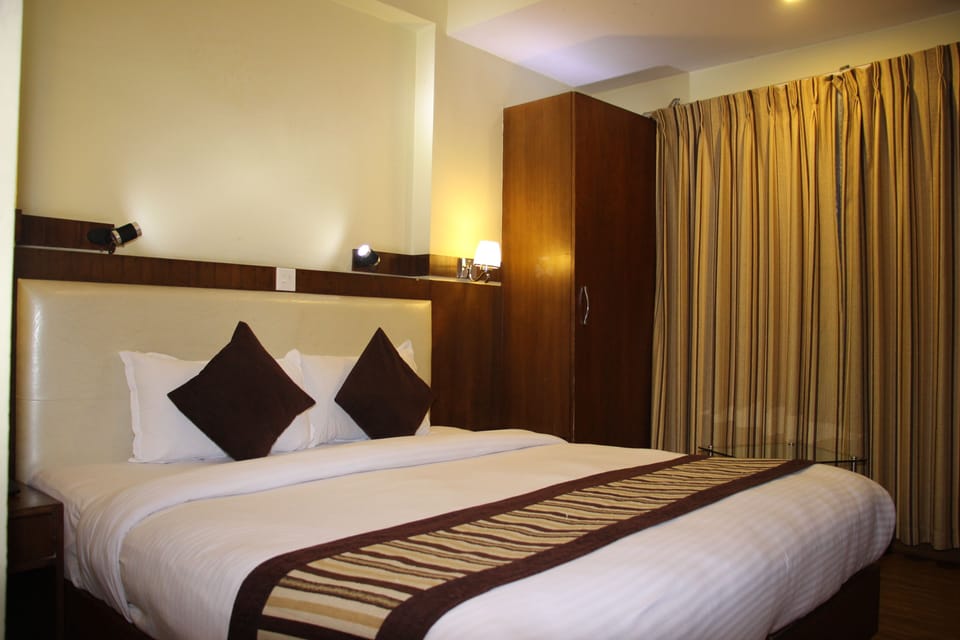 Deluxe Double or Twin Room | Pillowtop beds, individually decorated, desk, blackout drapes