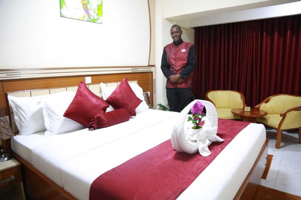 Deluxe Double Room | Minibar, in-room safe, desk, blackout drapes